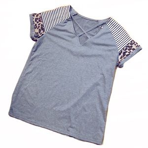 Women’s athletic shirt featuring animal print and stripes, Crisscross V neck